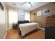 Bedroom features a queen-sized bed, hardwood floors, and natural light from windows at 714 Alwyn Blvd, Summerville, SC 29485
