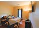 Inviting bedroom features a sunflower themed bedspread, hardwood floors, and a wall-mounted TV at 714 Alwyn Blvd, Summerville, SC 29485