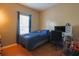 Relaxing bedroom with hardwood floors, a large window, and desk with computer at 714 Alwyn Blvd, Summerville, SC 29485