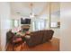 Cozy living room featuring a brick fireplace, comfortable seating, and ample natural light for relaxation at 714 Alwyn Blvd, Summerville, SC 29485