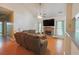 Cozy living room featuring a brick fireplace, comfortable seating, and ample natural light for relaxation at 714 Alwyn Blvd, Summerville, SC 29485