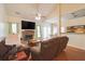 Cozy living room featuring a brick fireplace, comfortable seating, and ample natural light for relaxation at 714 Alwyn Blvd, Summerville, SC 29485