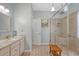Bright bathroom with a granite vanity and a large walk-in shower with a bench and glass enclosure at 801 Long Drive Rd, Summerville, SC 29485