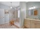 Elegant bathroom featuring a glass-enclosed shower, granite countertops, and a vanity with a decorative mirror at 801 Long Drive Rd, Summerville, SC 29485