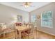Bright dining area featuring hardwood floors, natural light, and a ceiling fan at 801 Long Drive Rd, Summerville, SC 29485