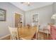 Cozy dining room with hardwood floors, perfect for Gathering meals and entertaining guests at 801 Long Drive Rd, Summerville, SC 29485