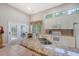 Spacious kitchen with granite countertops, white cabinets, stainless steel appliances, and views of the dining area and backyard at 801 Long Drive Rd, Summerville, SC 29485