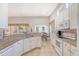 Bright kitchen featuring granite countertops, white cabinets, stainless steel appliances, and a breakfast bar at 801 Long Drive Rd, Summerville, SC 29485