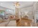 Inviting living room featuring hardwood floors, a fireplace, and an open concept design with views of the kitchen at 801 Long Drive Rd, Summerville, SC 29485