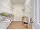 Walk-in closet with white wire shelving and carpeted floor, offering ample storage space at 801 Long Drive Rd, Summerville, SC 29485