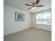 Empty bedroom with plush carpet, window for natural light, and minimal wall decor at 8725 Herons Walk, North Charleston, SC 29420