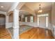 Inviting foyer with hardwood floors, elegant chandelier, and traditional molding create a grand entrance at 8725 Herons Walk, North Charleston, SC 29420