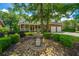 Beautiful brick home with a fountain in the front yard, surrounded by lush landscaping at 8725 Herons Walk, North Charleston, SC 29420