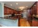 Gourmet kitchen featuring custom cabinets, granite countertops, and stainless steel appliances at 8725 Herons Walk, North Charleston, SC 29420