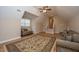 Spacious living room featuring hardwood floors, staircase, two sofas and large area rug at 8725 Herons Walk, North Charleston, SC 29420