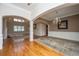 Spacious living room with hardwood floors, large windows, and elegant architectural details at 8725 Herons Walk, North Charleston, SC 29420