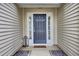 Elegant front door with sidelights, lantern, and stone pathway creating a warm welcome at 9016 Greenbriar Dr, Summerville, SC 29485