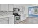 Bright kitchen with stainless steel appliances and modern countertops at 9016 Greenbriar Dr, Summerville, SC 29485