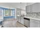 The bright eat-in kitchen features stainless steel appliances and backyard views at 9016 Greenbriar Dr, Summerville, SC 29485