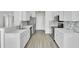 Modern kitchen featuring white cabinets, stainless steel appliances, and attractive backsplash at 9016 Greenbriar Dr, Summerville, SC 29485