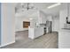 Well-lit kitchen featuring white cabinets, stainless steel appliances, and hardwood flooring at 9016 Greenbriar Dr, Summerville, SC 29485