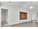 Modern living room with hardwood floors, ceiling fan and built-in shelving at 9016 Greenbriar Dr, Summerville, SC 29485
