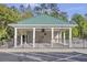 Covered pool pavilion with ceiling fans, signage, and black metal fence at 9016 Greenbriar Dr, Summerville, SC 29485