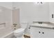 Clean bathroom featuring a shower-tub combo, toilet, and vanity with gray countertops and white cabinets at 902 Greenmeadow Dr, Goose Creek, SC 29445