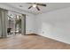 Bright bedroom featuring sliding glass doors to the outdoor patio, recessed ceiling light and wood-look floors at 902 Greenmeadow Dr, Goose Creek, SC 29445
