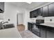 Bright kitchen featuring dark cabinets, modern appliances, and durable tiled floors at 902 Greenmeadow Dr, Goose Creek, SC 29445