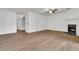 Spacious living room with wood floors, a fireplace, and doorways leading to other rooms at 902 Greenmeadow Dr, Goose Creek, SC 29445