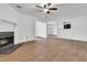 Open living space showing wood floors, a fireplace, and an opening to the kitchen at 902 Greenmeadow Dr, Goose Creek, SC 29445