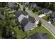 Aerial view of neighborhood with home, manicured lawn, and backyard privacy fence at 9680 Spencer Woods Rd, Ladson, SC 29456