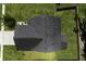 Aerial view of roof and yard shows manicured lawn and privacy fence at 9680 Spencer Woods Rd, Ladson, SC 29456