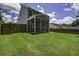 Spacious backyard with a screened porch, perfect for outdoor relaxation and entertainment at 9680 Spencer Woods Rd, Ladson, SC 29456