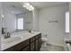 Bathroom featuring double sinks, a large mirror, and a separate tub and shower at 9680 Spencer Woods Rd, Ladson, SC 29456
