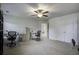 Bedroom with neutral carpet, 2 office chairs, a ceiling fan, and double closets at 9680 Spencer Woods Rd, Ladson, SC 29456
