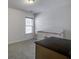 Cozy Bedroom with a white crib, neutral carpet, a window, and a dresser at 9680 Spencer Woods Rd, Ladson, SC 29456
