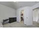 Bedroom with a small bed, neutral carpet, a dresser, and a closet at 9680 Spencer Woods Rd, Ladson, SC 29456