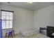 Bedroom with neutral carpet, a window, a twin bed, a small table with chairs, and a dresser at 9680 Spencer Woods Rd, Ladson, SC 29456