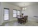 Bright dining area with a door to the outside and a chandelier at 9680 Spencer Woods Rd, Ladson, SC 29456
