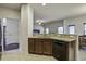 Kitchen with granite countertops and a view into the Gathering room with an open layout at 9680 Spencer Woods Rd, Ladson, SC 29456