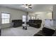 Spacious living room with ample seating and natural light streaming through large windows at 9680 Spencer Woods Rd, Ladson, SC 29456