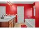 Vibrant bathroom featuring a double sink vanity and separate tub at 9759 Seed St, Ladson, SC 29456