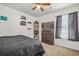 Cozy bedroom with ceiling fan, closet and view to backyard at 9759 Seed St, Ladson, SC 29456