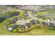 An eye-level aerial shot of homes with fences and landscaped yards bordering a pond and greenery at 102 Bolsena Ct, Summerville, SC 29486
