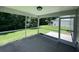 Screened porch with view of the backyard and surrounding greenery; a great outdoor space at 1039 Steelechase Ln, Hanahan, SC 29410