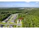 Aerial view of a neighborhood, illustrating its proximity to surrounding woods and nature at 105 Plowden Mill Ct, Summerville, SC 29485