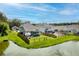 Expansive backyard features lush green grass, a charming patio set, and a relaxing swimming pool, all fenced in at 105 Plowden Mill Ct, Summerville, SC 29485