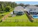 Aerial view of a manicured backyard, featuring a patio and fire pit area at 105 Plowden Mill Ct, Summerville, SC 29485